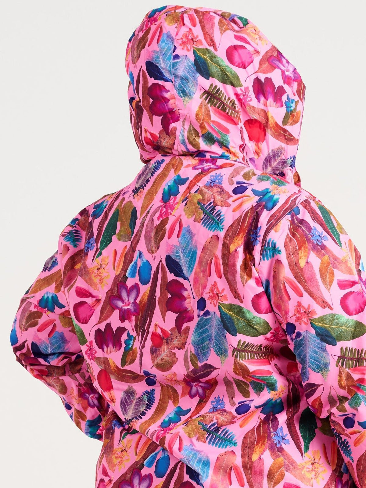 Zee wearing the Backyard Treasures Longline Raincoat in size 3XL, colourful printed waterproof raincoat