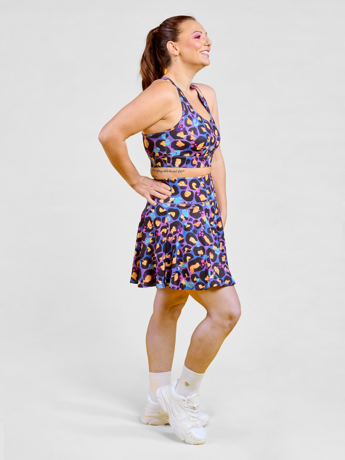 Berry Leopard Ultimate Racerback Crop - Petite friendly racerback sports bra with sewn in paddin, worn by Jaime