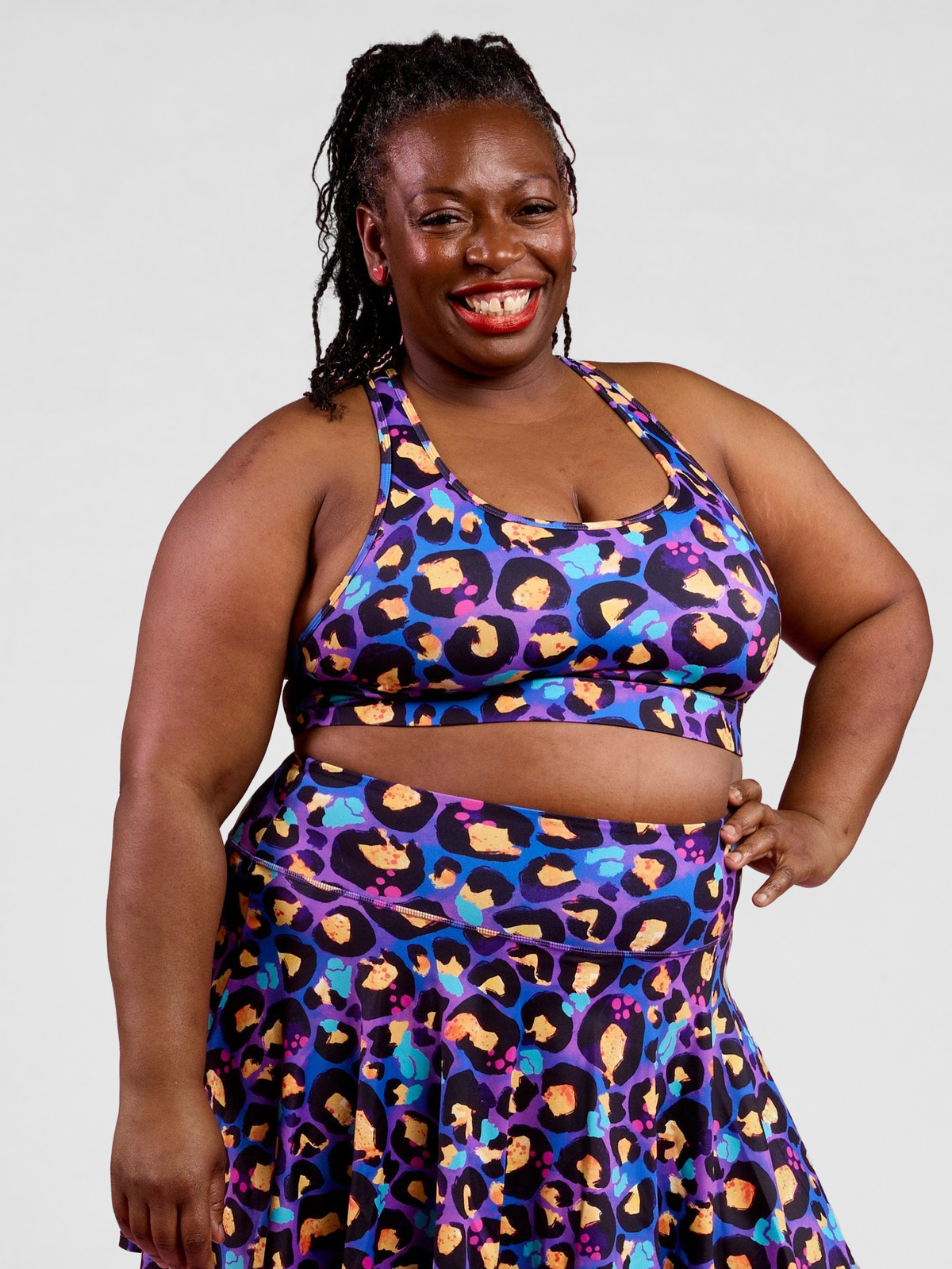 Berry Leopard Ultimate Racerback Crop - Close up sports bra fabric colourful print detail, worn by Zee
