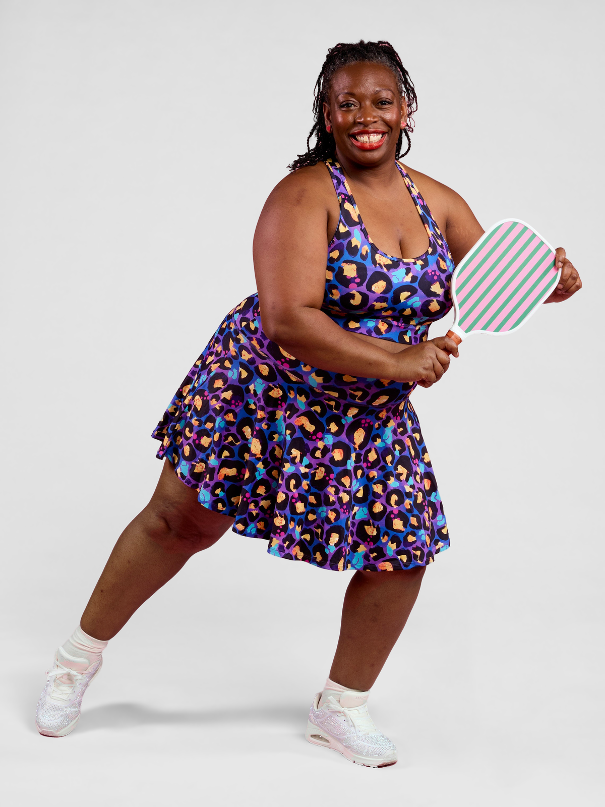 Berry Leopard Ultimate Racerback Crop - Plus size racerback sports bra with medium support and padding, worn by Zee