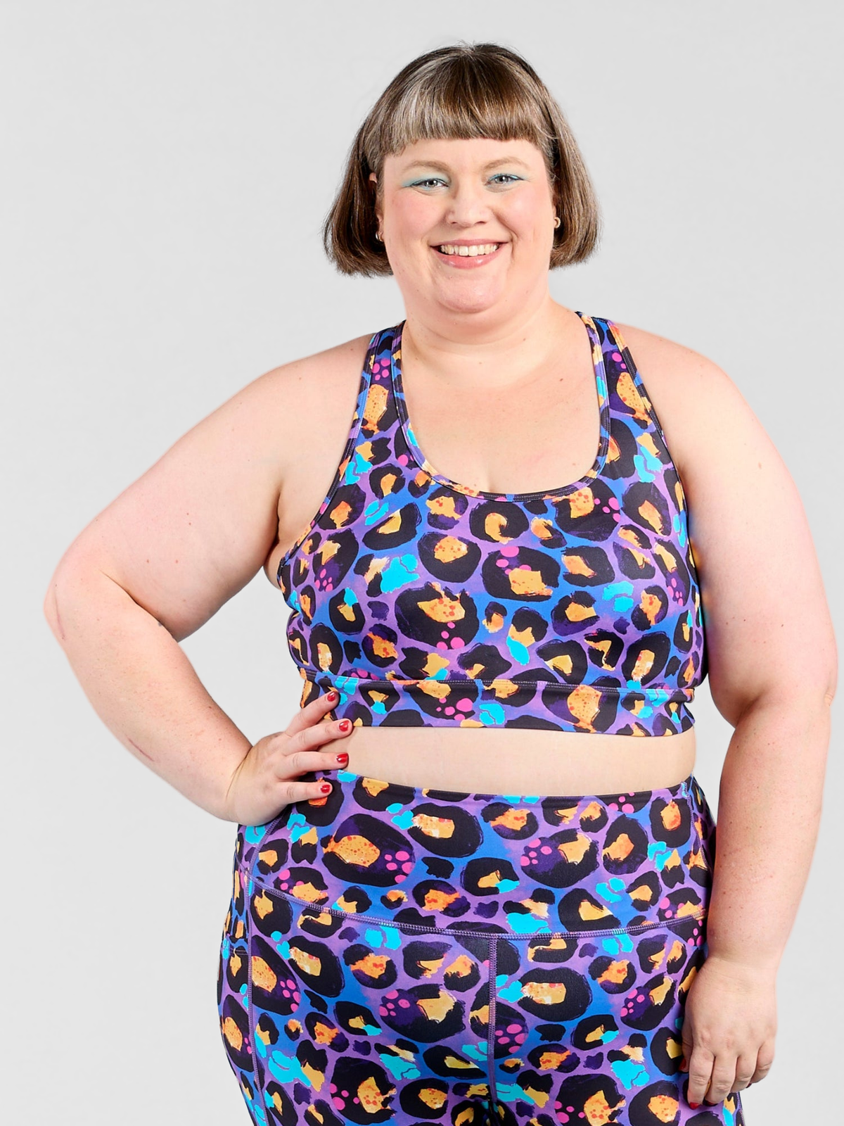 Berry Leopard Ultimate Racerback Crop - Plus size high impact sports bra, worn by Kathleen