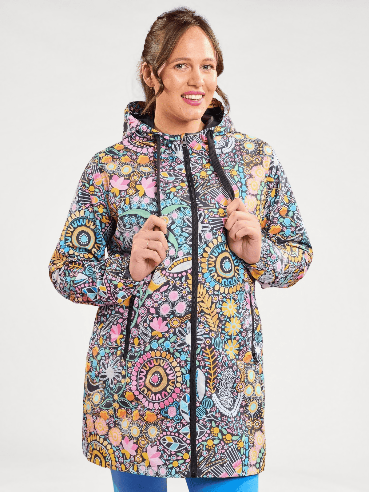 Coastal Wildflowers Longline Raincoat - Waterproof raincoat aboriginal print, worn by Kirra