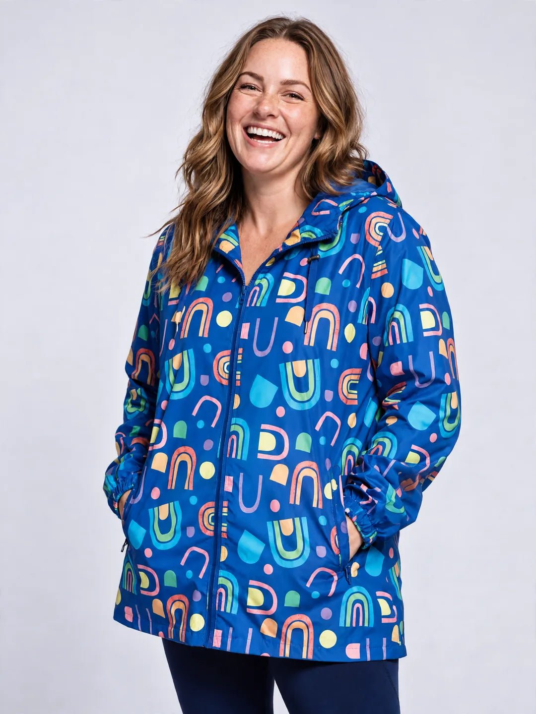Rainbow Warrior Raincoat - Adults on model Chloe (AU Size 14 / L) - Relaxed pose with hands in pockets