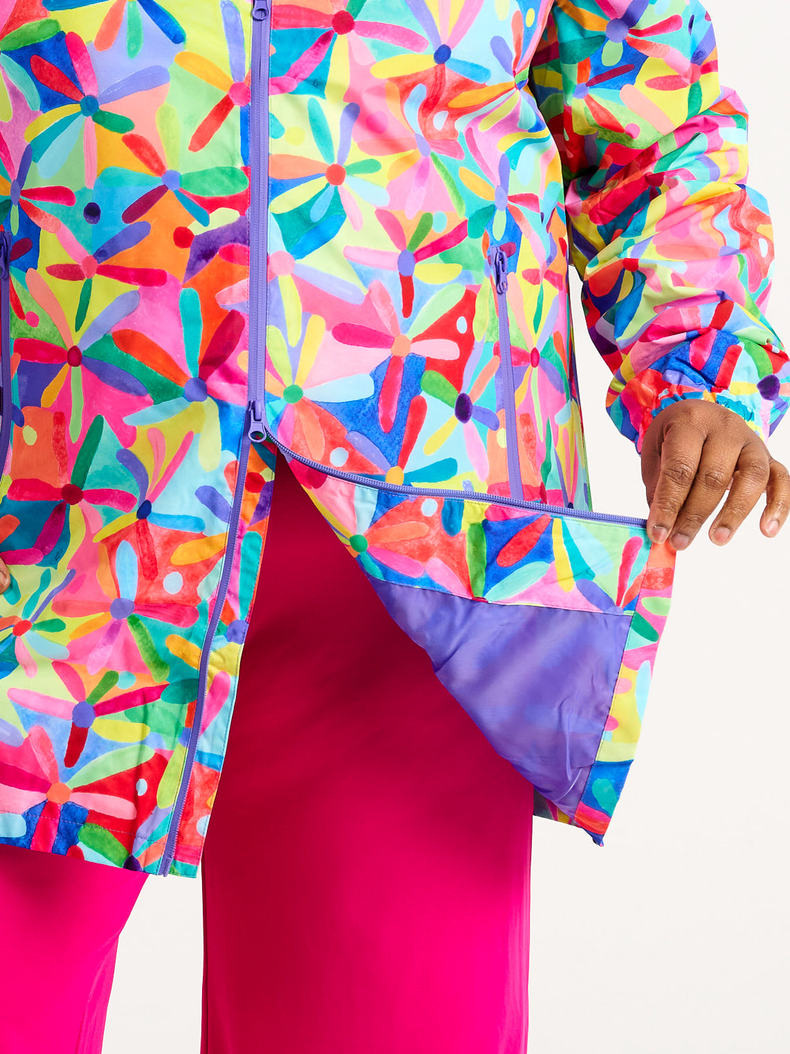 Rainbow Daisies Longline Raincoat - Double zip waterproof raincoat, worn by Zee