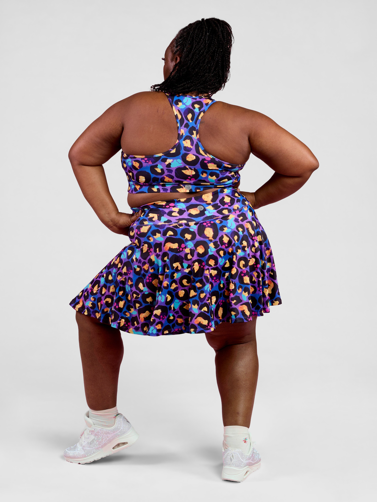 Berry Leopard Ultimate Racerback Crop - Colourful racerback gym bra with supportive fit and comfort, worn by Zee