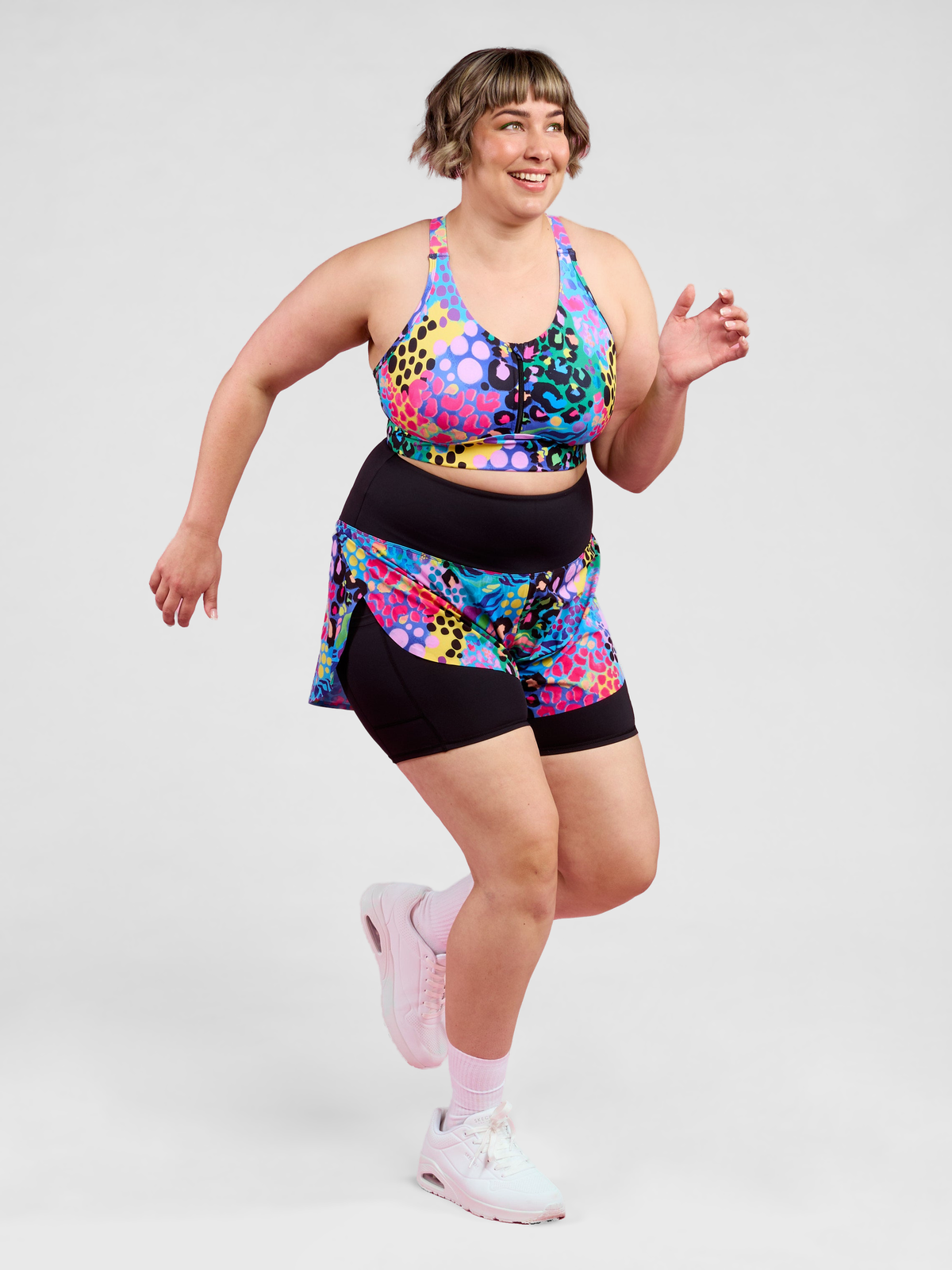 Electric Leopard FlexiZip Crop II - Sports bra made from recycled plastic bottles, worn by Steph