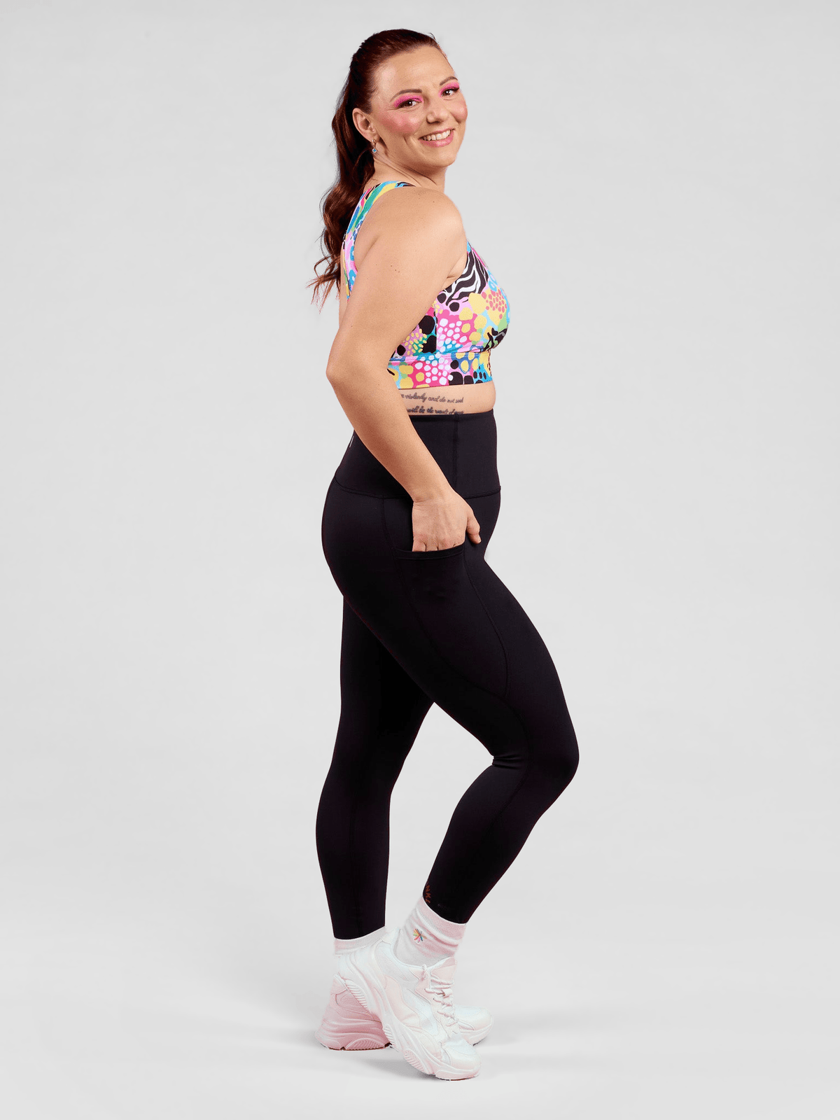 Rainbow at Heart Everyday Black Legging - 7/8 length - Black compression leggings high waisted with pockets for training, worn by Jaime