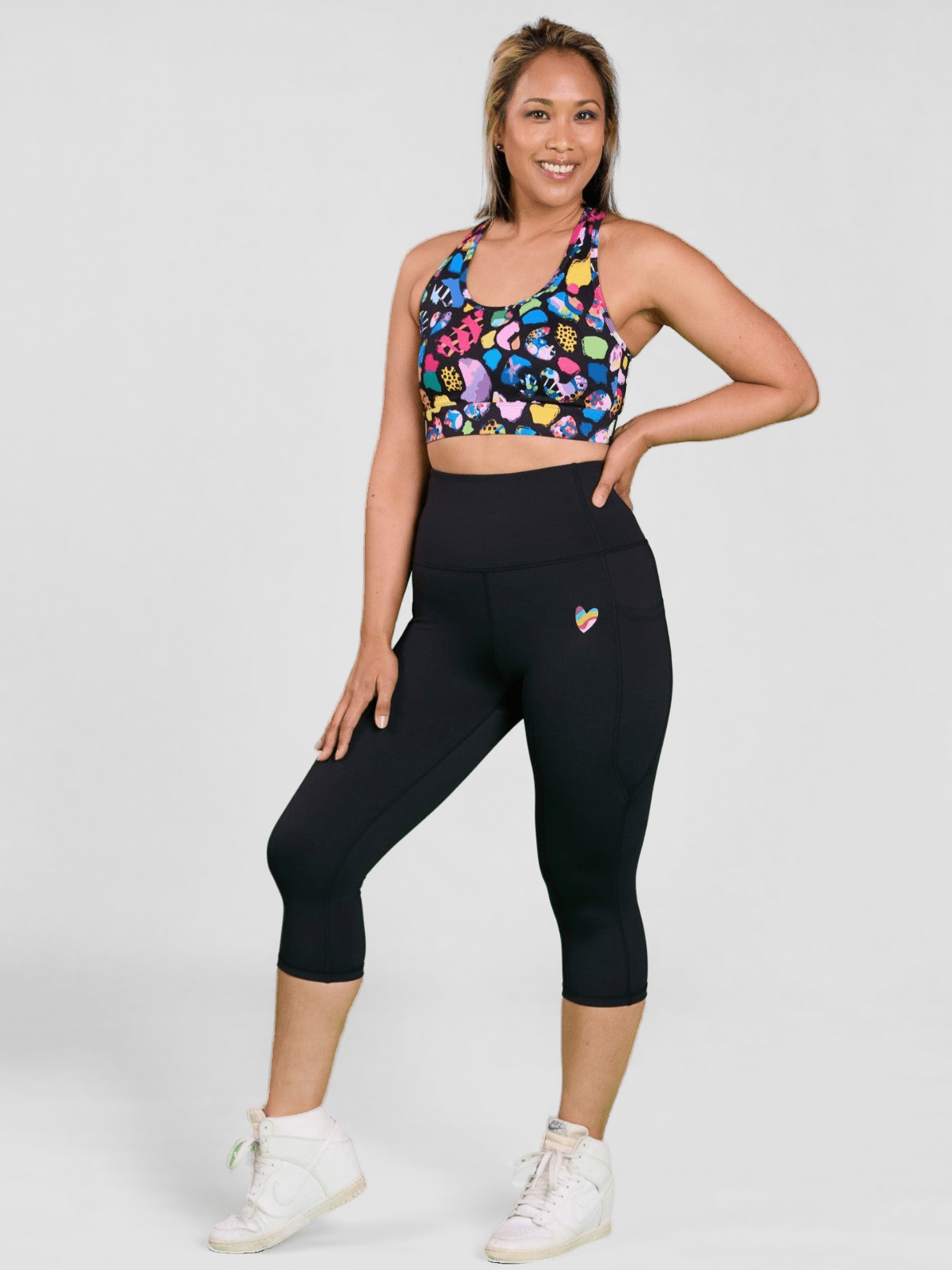 Rainbow at Heart Everyday Cropped Legging - 3/4 length - high waisted running cropped black leggings with pockets, worn by Raquel