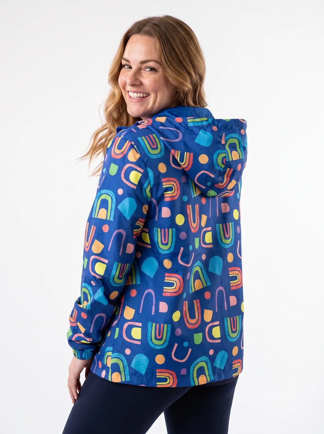 Rainbow Warrior Raincoat - Adults on model Chloe (AU Size 14 / L) - Relaxed pose with hands in pockets